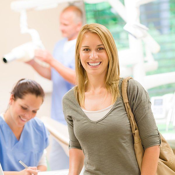 Woman in dental office smiling