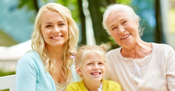 Three generations of women with healthy smiles thanks to preventive dentistry