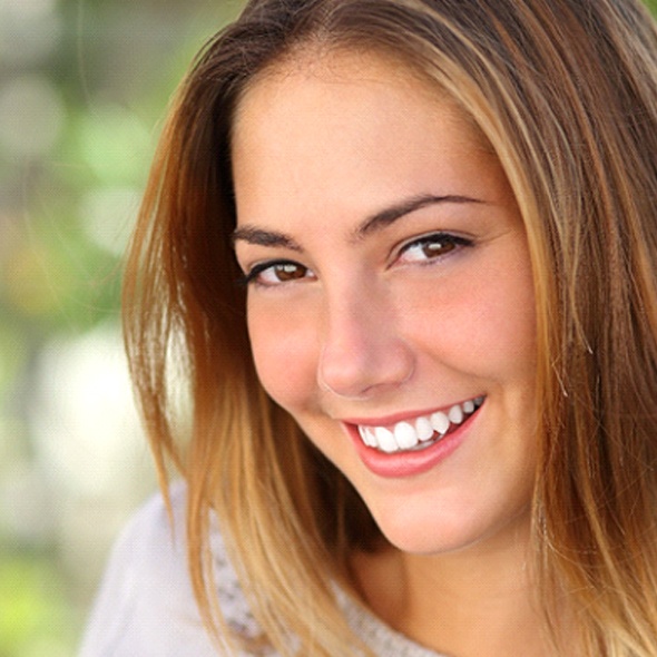 woman enjoying the benefits of working with the cosmetic dentist in Virginia Beach